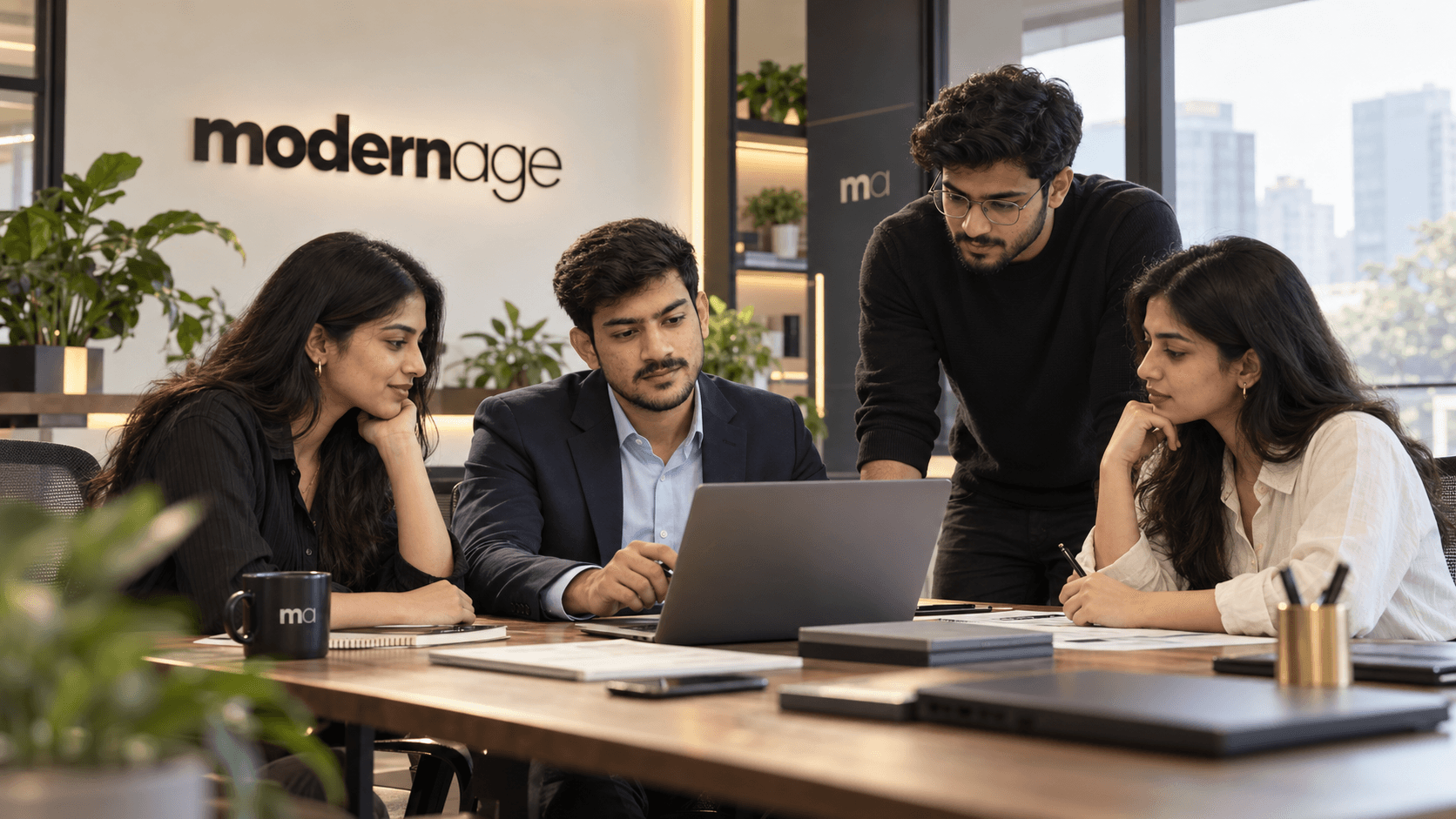 The Modern Age team working through a plan together at the studio table